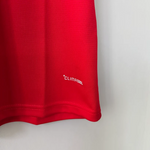Red shirt with 'ClimaCool' logo on a light gray background