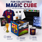 A Barcelona FC collectible set displayed on a white background with promotional text. The set includes a blue and red striped FC Barcelona jersey, two water bottles, a black display box with flags, a framed photo, a small trophy, a colorful cube-shaped box with stadium graphics and FC Barcelona branding, a clear acrylic Barcelona crest plaque, and a matching mug.