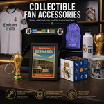 A collection of Real Madrid and FIFA-themed collectible fan accessories displayed on a dark shelf, including a Santiago Bernabeu framed poster, a World Cup trophy keychain, a blue illuminated Real Madrid badge, a white bottle with team graphics, a cube puzzle, and a mug, with promotional text above and icons below.