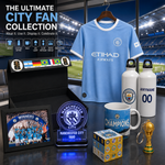 Manchester City themed fan collection display featuring a light blue jersey, two white customizable water bottles, a mug, a framed photo, a plaque, a box, a small trophy, and a display box in a stadium-themed room setup.