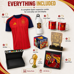 A Spain football supporter bundle displayed on a beige background with labeled callouts. The set includes a red and navy home jersey, a white custom sipper bottle, two red ceramic mugs, an LED lamp, a framed photo, a trophy keychain, a club cube, a gift box, and a branded box.
