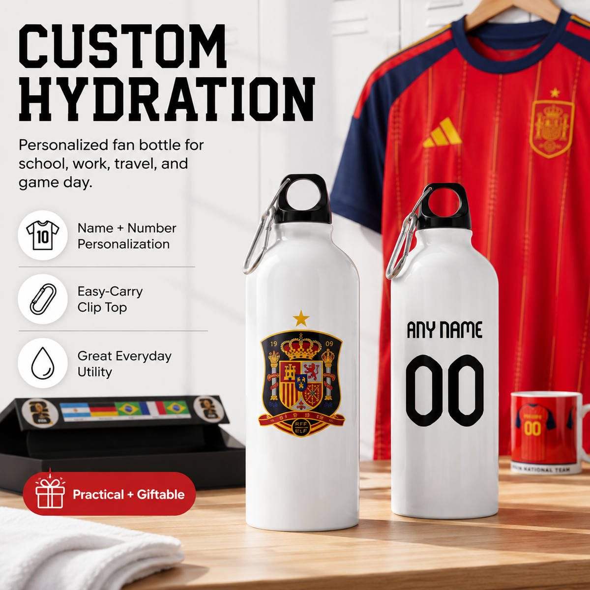 Two white personalized water bottles displayed on a wooden table, one with a Spain national team crest and the other with 'ANY NAME 00' printed on the front. A red Spain soccer jersey hangs in the background, and promotional text on the left highlights customization options.