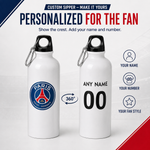 Two white customizable water bottles with black caps and carabiners on a light gray background. The left bottle shows the Paris Saint-Germain logo, and the right bottle shows placeholder text for personalization.