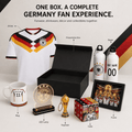Germany soccer fan experience gift set in one box, featuring a white Germany jersey, presentation box, water bottles, mug, LED lamp, keychain, cube, and framed print on a clean white background with labeled callouts.