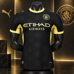 Black Manchester City home soccer jersey with yellow accents, displayed on a black mannequin. The jersey features the Etihad Airways sponsor logo on the chest, the Manchester City crest, and a subtle bee pattern across the fabric.